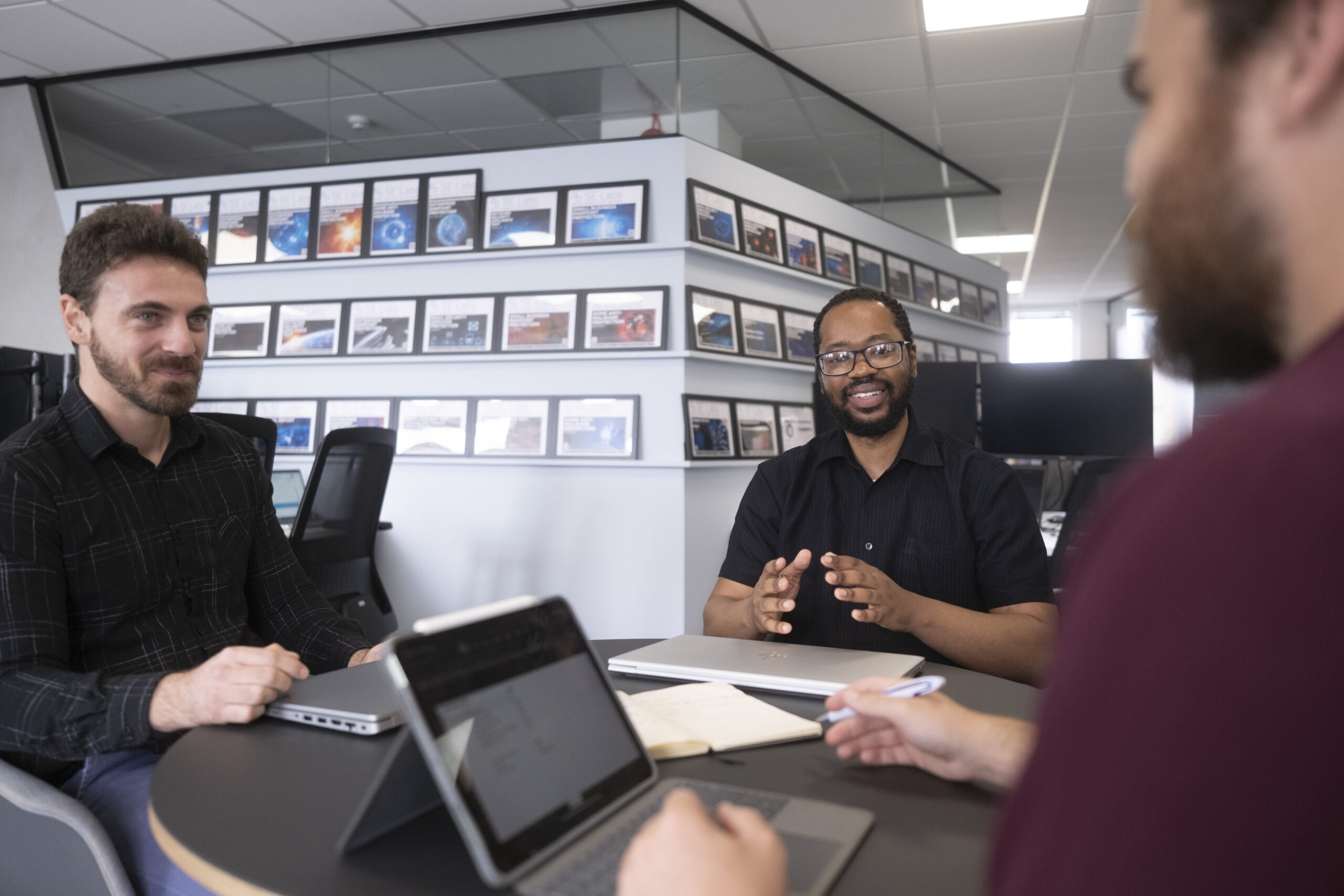 Three of SE Labs' testing team at work